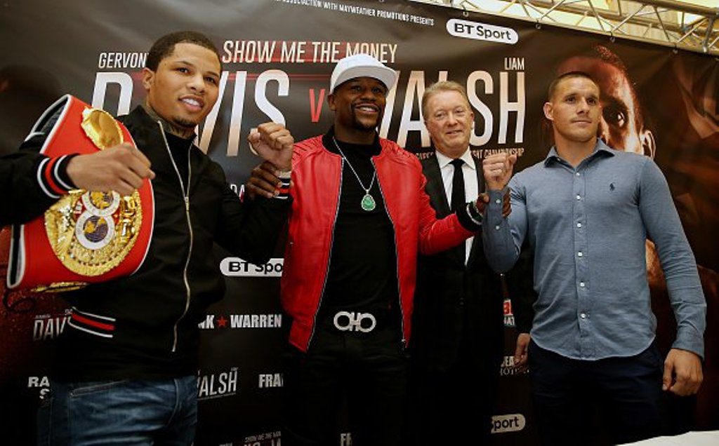 Mayweather [middle] introduces Gervonta Davis [left] and Liam Walsh to the cameras