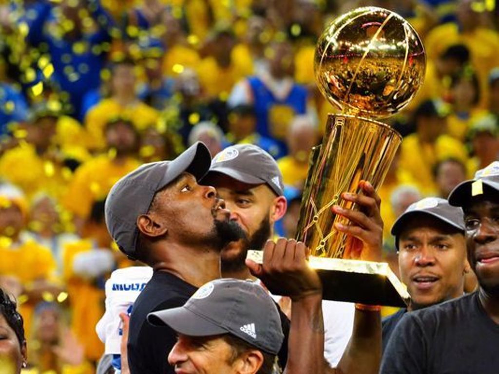Durant hoisting the 2017 NBA trophy