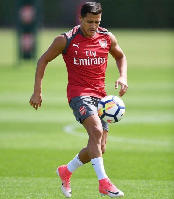 Alexis Sanchez joggling with the ball as he returns to Arsenal training