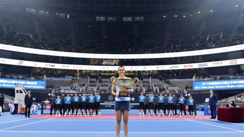 Caroline Garcia poses with the trophy in Beijing