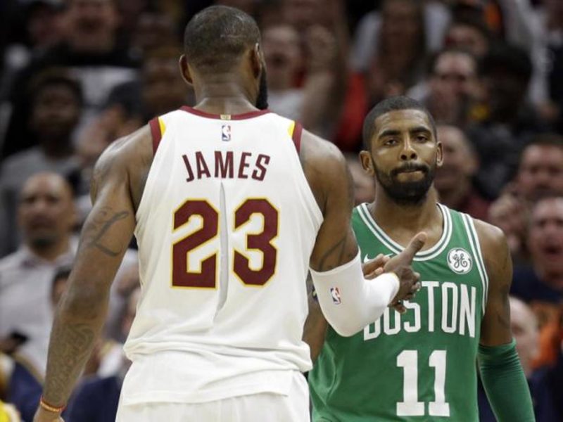 Kyrie Irvin shakes hands with former teammate LeBron James