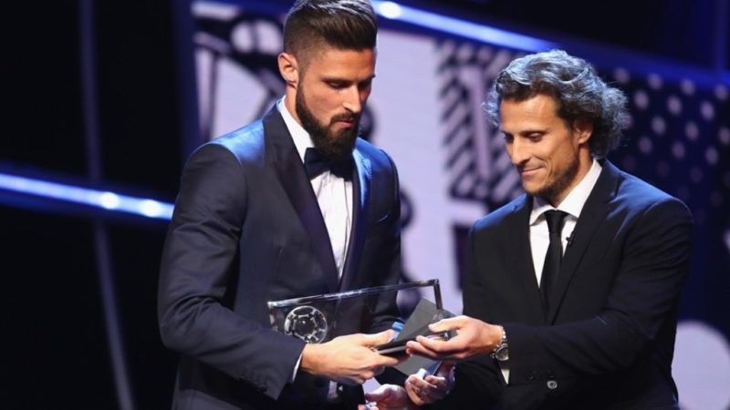 Olivier Giroud of France and Arsenal accepts the Puskas Award from Diego Forlan