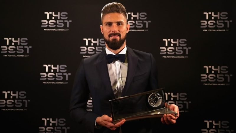 Olivier Giroud poses with his Puskas Award
