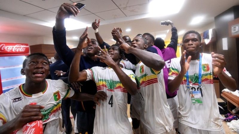 Players of Mali celebrating their win against Ghana with a selfie pose