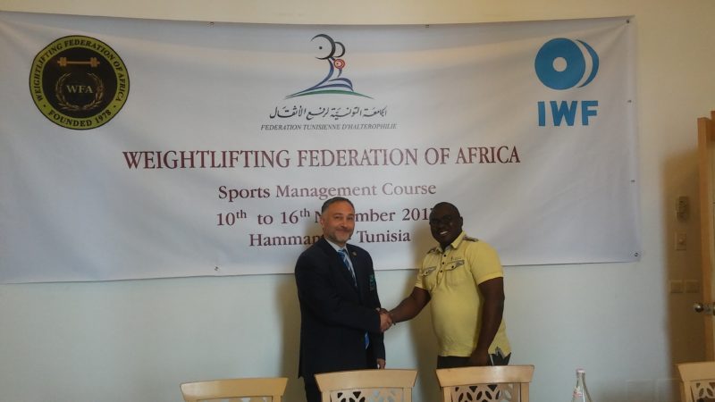 Ghana's Ken Odeng Adade [right] exchanging pleasantries with Professor Milan Mihajlovic