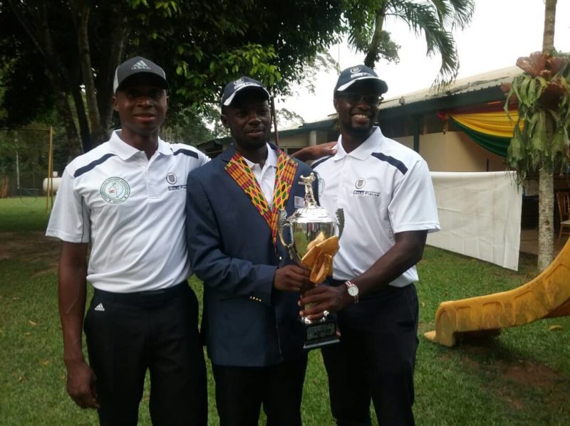 Kojo Barnni [middle] flexes with the 2017 PGA trophy