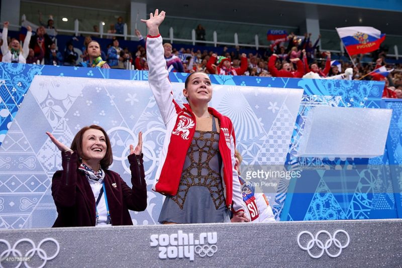 Adelina Sotnikova of Russia waves to fans after her socre announced in the Figure Skating Ladies