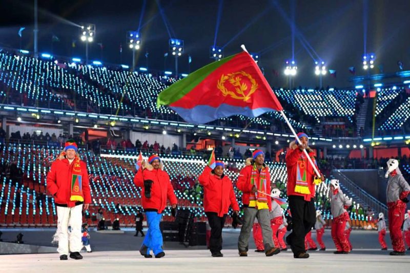 Flag bearer Shannon-Ogbani Abeda of Eritrea and teammates arrive at the stadium during the Opening Ceremony of the PyeongChang 2018 Winter Olympic Games