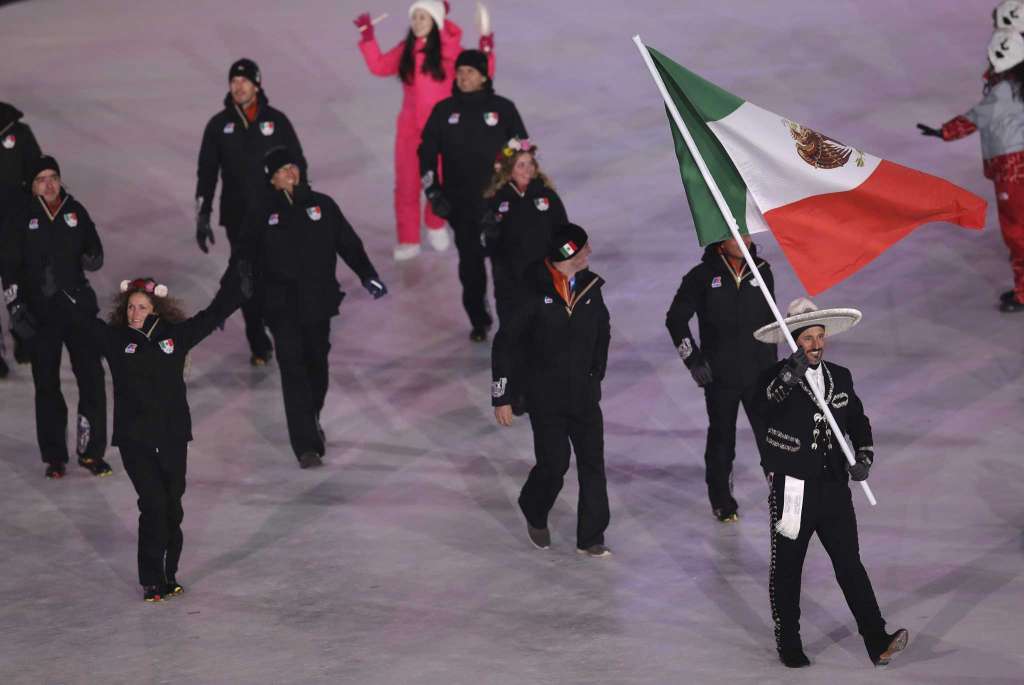 German Madrazo carries the flag of Mexico during the opening ceremony of the 2018 Winter Olympics
