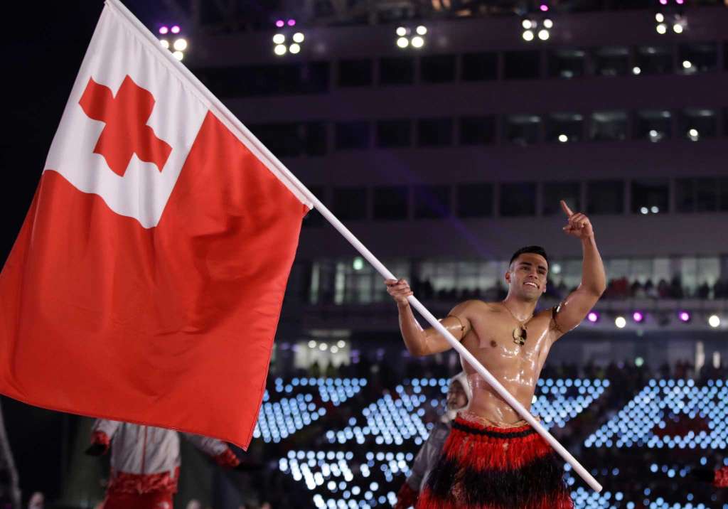 Pita Taufatofua carries the flag of Tonga during the opening ceremony of the 2018 Winter Olympics in Pyeongchang