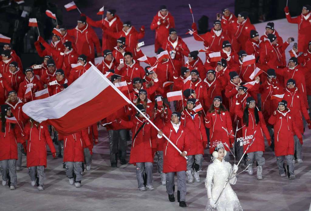 Zbigniew Brodka carries the flag of Poland during the opening ceremony of the 2018 Winter Olympics
