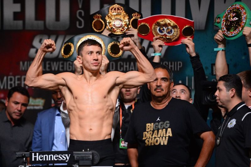 Abel Sachez [in the BIGGG Drama show outfit] standing behind Gennady Golovkin
