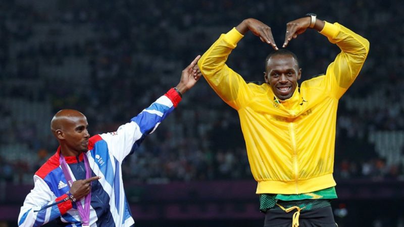 Mo Farah [left] with Usain Bolt on the podium
