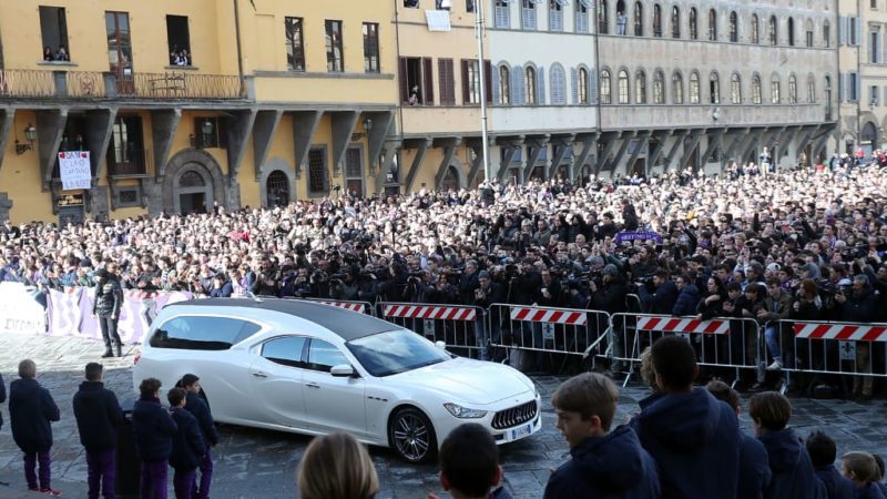 The coffin of Davide Astori arrives by hearse before being carried into Santa Croce church