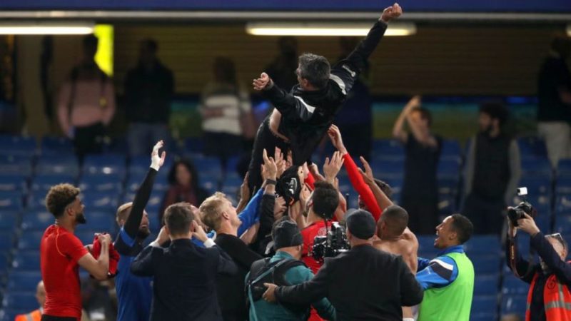 Huddersfield's players and manager David Wagner celebrate Premier League survival