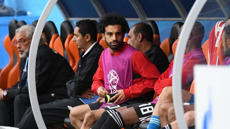 Salah looking on from the bench
