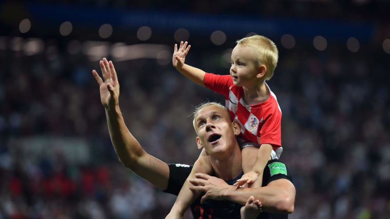 Domagoj Vida of Croatia celebrates with his son