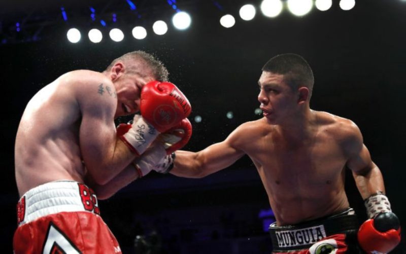 Jaime Munguia (R) of Mexico improved to 30-0 with 25 knockouts
