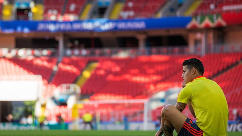 James Rodriguez watches on from the side lines as his teammates train