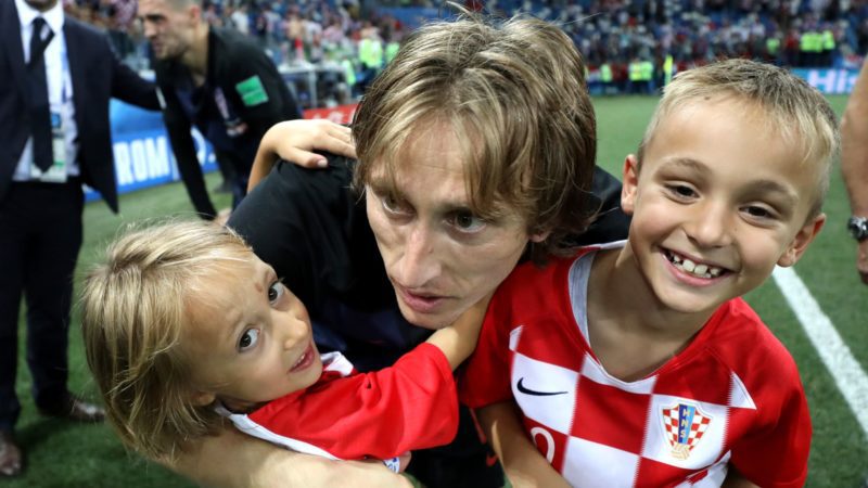 Luka Modric of Croatia celebrates with his family