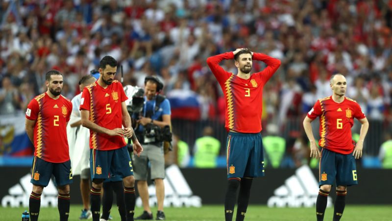 Spain players look dejected following team mate Koke missing his penalty kick