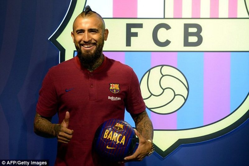 Arturo Vidal (pictured) poses in front of the Barcelona crest