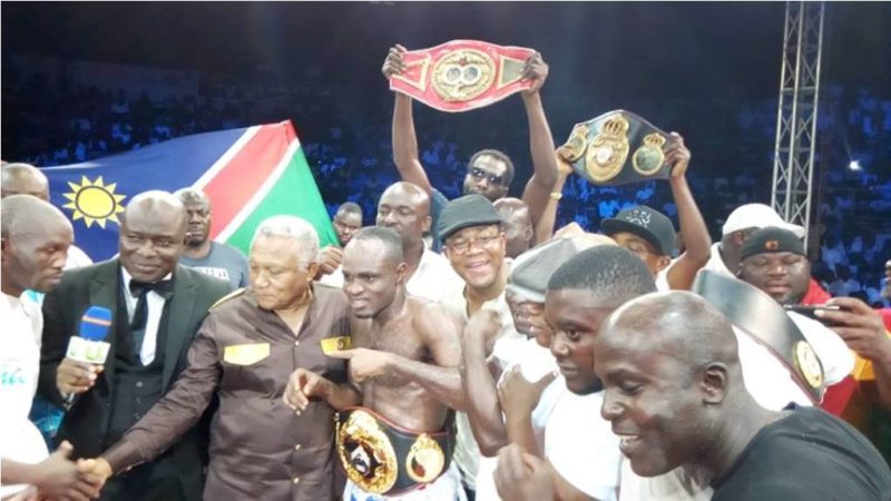 Emmanuel 'Game Boy' Tagoe being cheered up for his victory over Paulus Moses