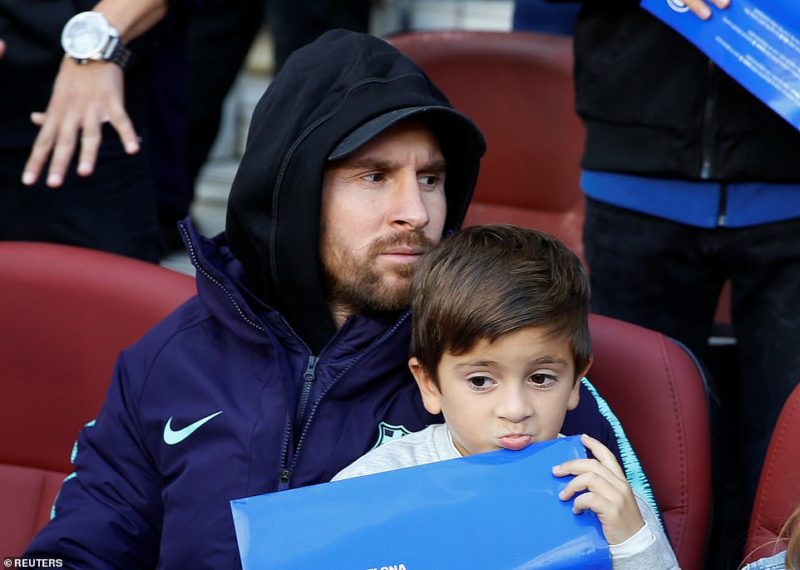 Lionel Messi, currently [injured] watches the match from the Nou Camp sidelines