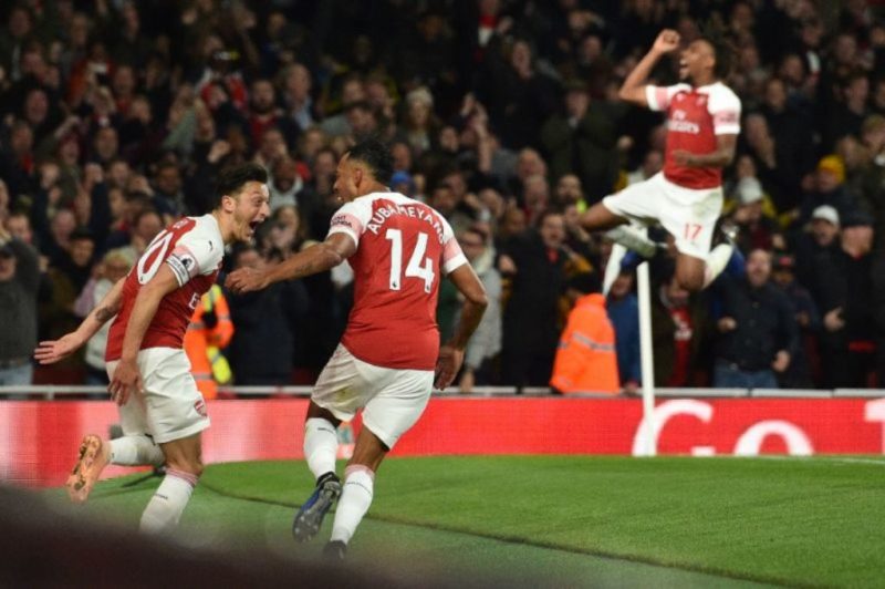 Pierre-Emerick Aubameyang celebrated with Mesut Ozil as Arsenal saw off Leicester